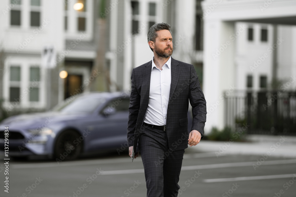 Business man in classic suit, blue jacket and white shirt. Fashion man in suit walk outdoors. Businessman in fashion suit walking in city. Business fashion street style. Man in trendy suit. Modern Business man in classic suit, blue jacket and white shirt. Fashion man in suit walk outdoors. Businessman in fashion suit walking in city. Business fashion street style. Man in trendy suit. Modern