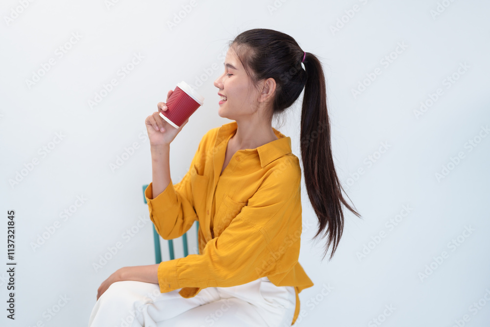 Asian woman hold coffee cup with yellow shirt on white background Asian woman hold coffee cup with yellow shirt on white background