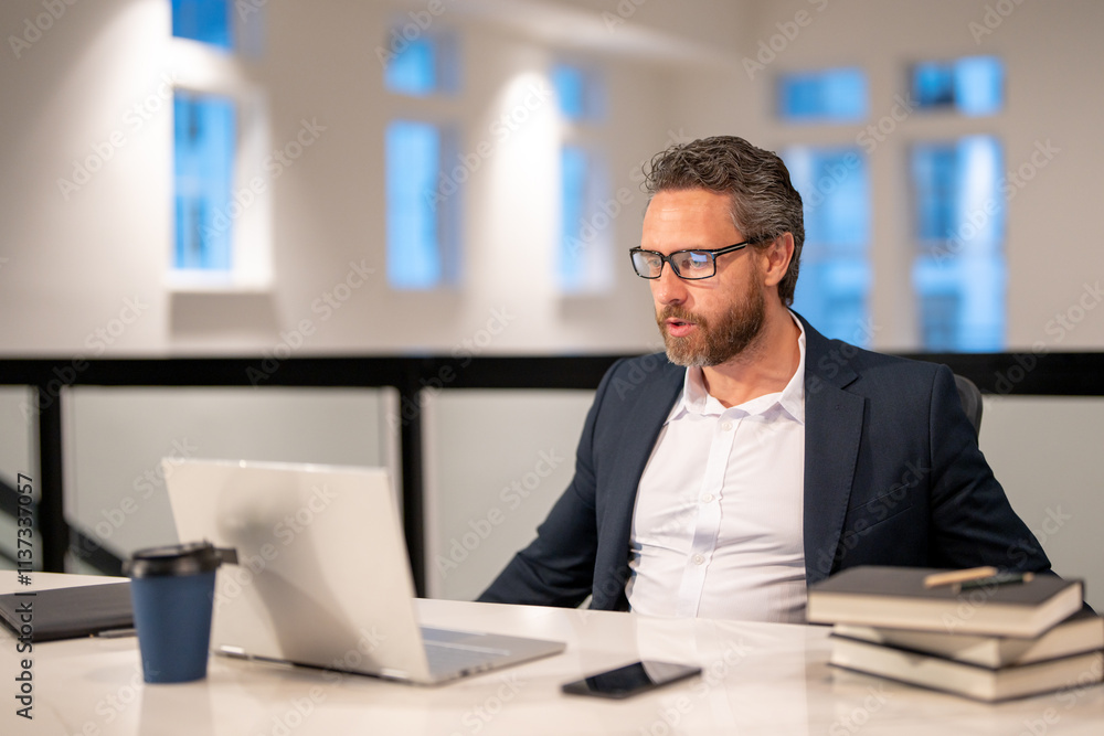 Office worker with laptop at office. Ofice employee remote working in modern office. Businessman have on line meeting. Business man using computer in office. Modern offices workplace. Office worker with laptop at office. Ofice employee remote working in modern office. Businessman have on line meeting. Business man using computer in office. Modern offices workplace.