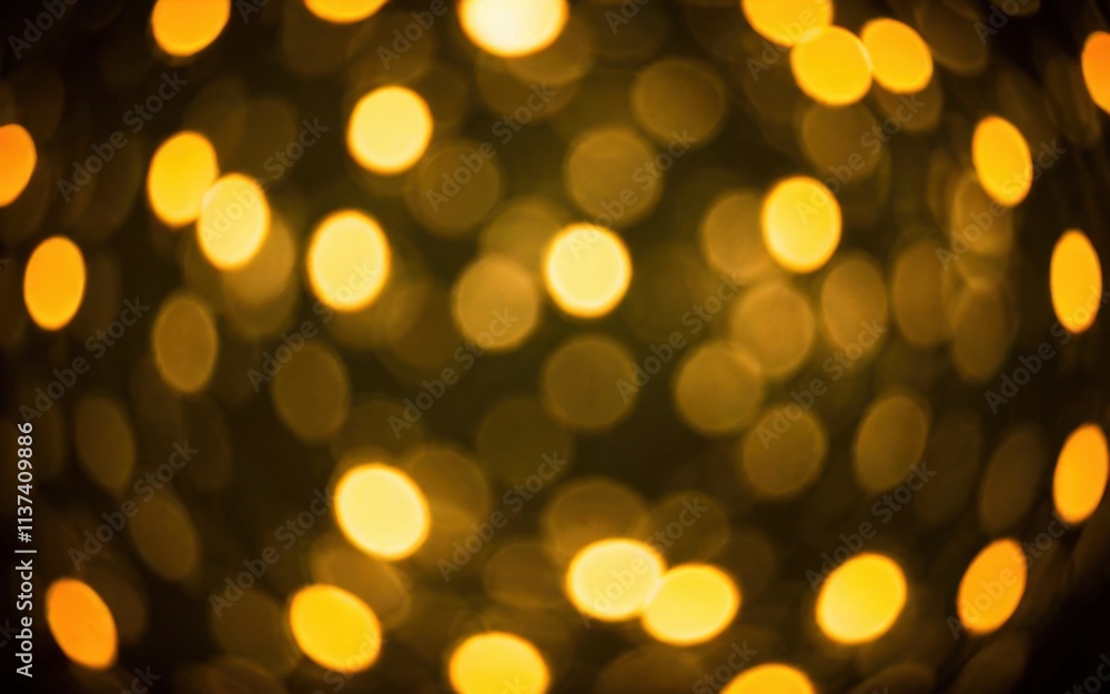 Fototapeta premium A blurred background of warm yellow bokeh lights creating a cozy ambiance.