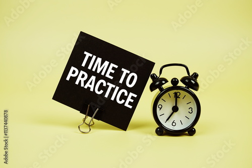 Time to Practice text message on paper card with alarm clcok on yellow background