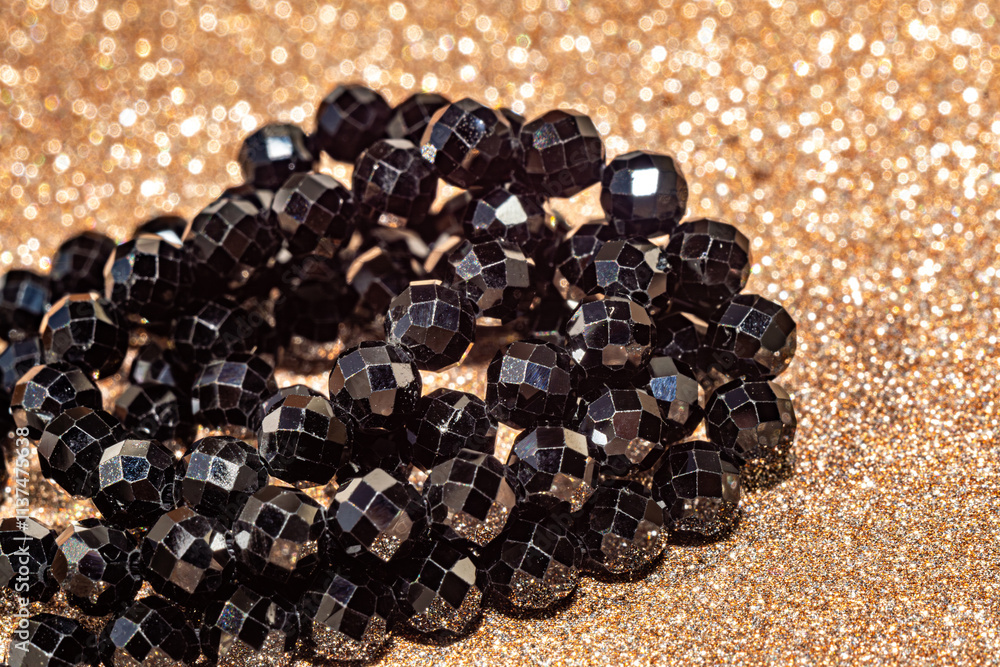 Beautiful faceted beads of black spinel in macro photography, perfect for crafting and jewelry design. Decorative round stone beads of black color for boho jewelry design. Beautiful faceted beads of black spinel in macro photography, perfect for crafting and jewelry design. Decorative round stone beads of black color for boho jewelry design.