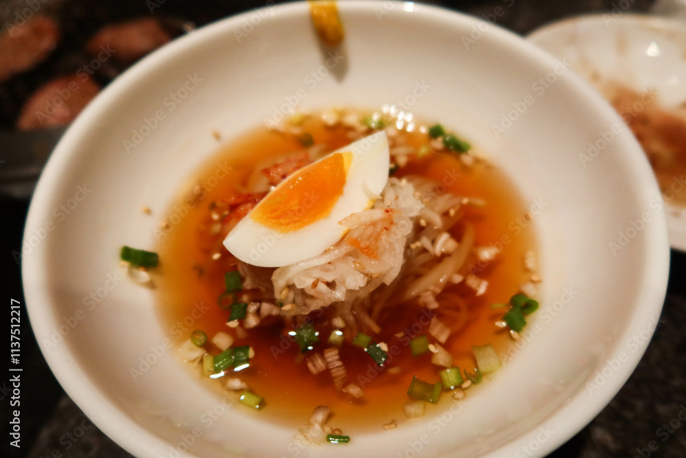 close up of cold Japanese water noodles with vinegar and boiled egg slice, spring onion and sesame close up of cold Japanese water noodles with vinegar and boiled egg slice, spring onion and sesame