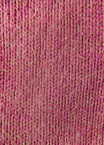 Wool fabric photographed close-up in a special design. Texture faded material. Clothing red background sweater