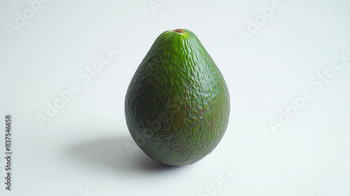 Single green avocado on light background photo