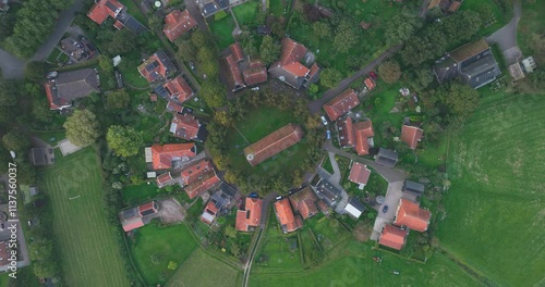 Aerial drone video of the small picturesque village Niehove, Groningen, The Netherlands, 13th centurty church. photo