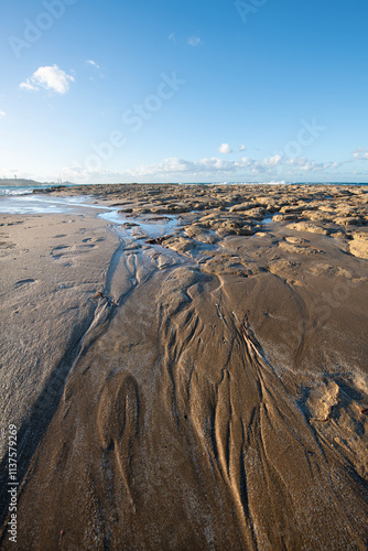 Alagadi Turtle Beach in Cyprus at sunset. View from the beach to the sea. Magnificent beach, sea and blue cloudy sky.