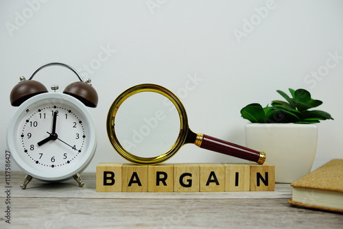 Magnifying glass and alarm clock with wooden blocks alphabet letters BARGAIN text message on wooden background photo