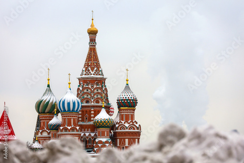 View to St Basil's Cathedral through snow drifts on Red square in Moscow, russian winter