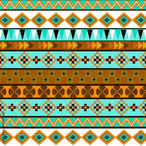 American ethnic tribal fabric pattern stands out with its unique and vibrant blue and green tones, bringing life and ethnic to the design. The bright coloring ethnic the visual appeal, creating   photo