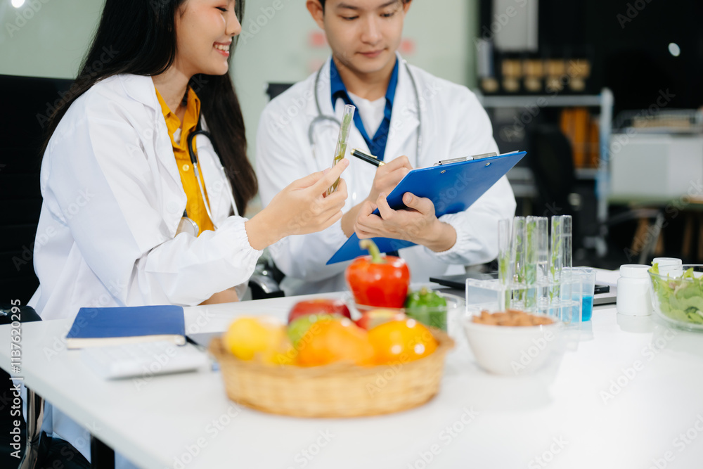 Nutritionists consulting on healthy food choices, meal planning, and wellness concepts Nutritionists consulting on healthy food choices, meal planning, and wellness concepts