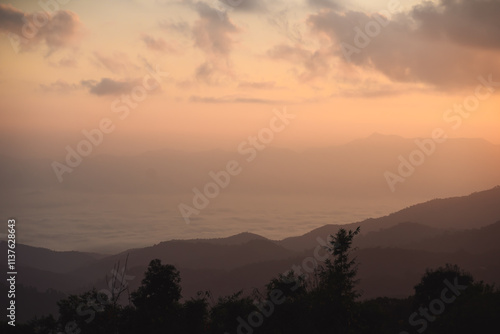 landscape and travel concept with sunrise and layer of mountain and mist with forest on morning