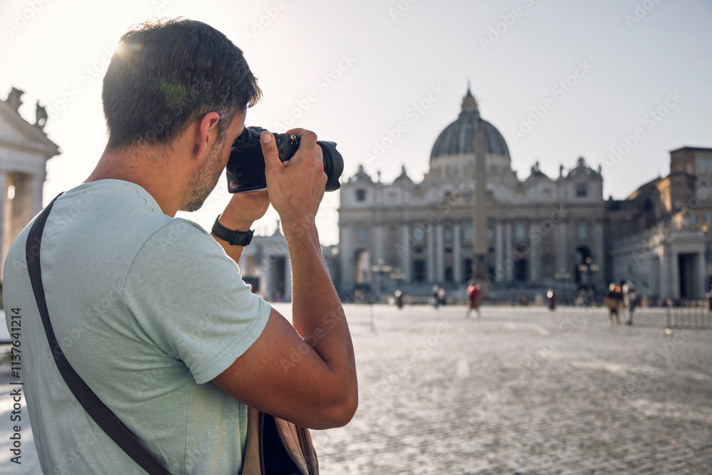 © Westend61 - Man clicking photos of St. Peter's Basilica through digital camera © Westend61 - Man clicking photos of St. Peter's Basilica through digital camera