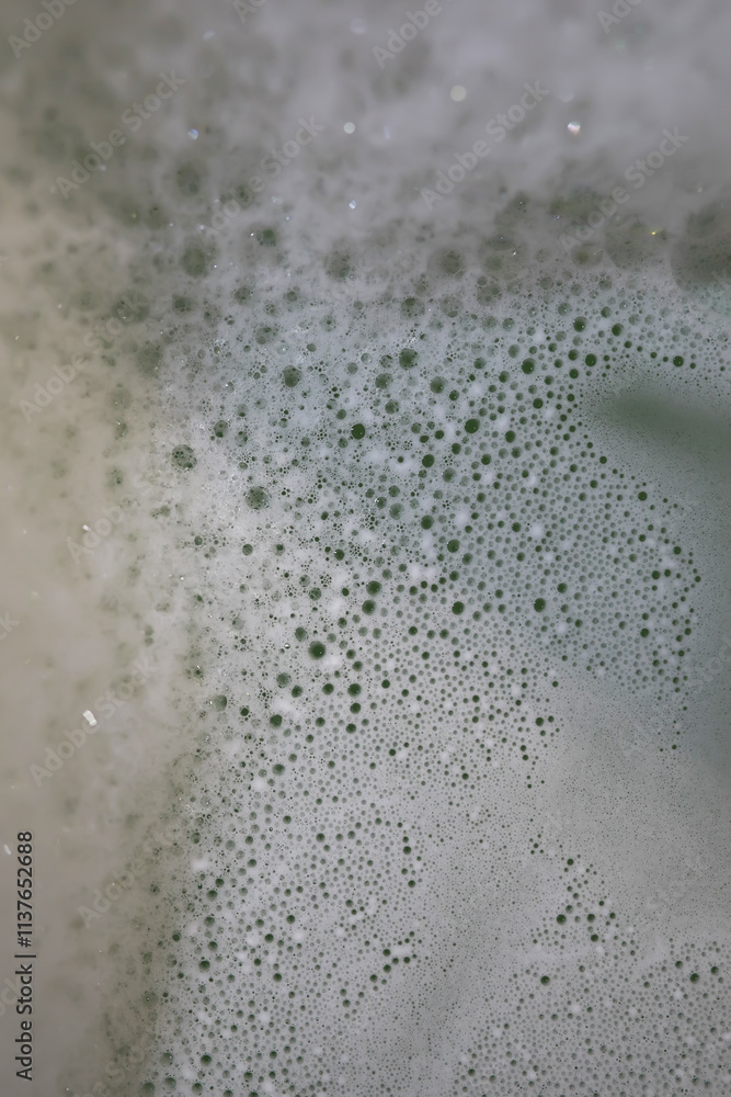 Close-Up of Soap Foam Bubbles with Varying Sizes and Patterns Close-Up of Soap Foam Bubbles with Varying Sizes and Patterns