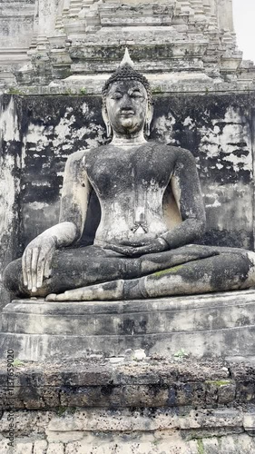 Sukhothai art Buddha statue at Wat Mahathat Cheliang, Sukhothai, Buddha statue in the Mara-Vijaya attitude and standing Buddha statue in the Leela attitude