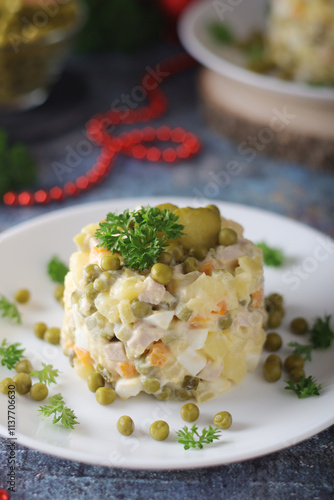 Olivier salad, traditional Russian dish, served on the plate	 photo