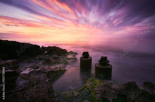 Sunset Over Coastal Ruins and Rocks, Spain photo