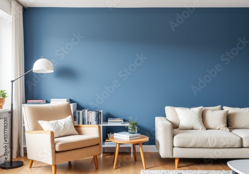 Beige armchair near sofa. Book shelf and floor lamp against blue wall. Scandinavian home interior design of modern living room photo