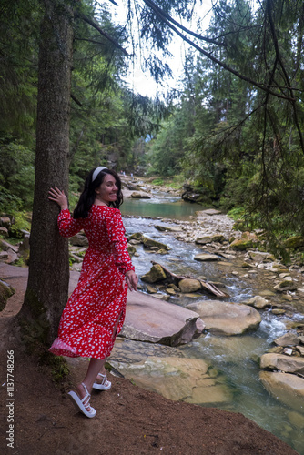 Woman in Red Dress by Serene Forest River