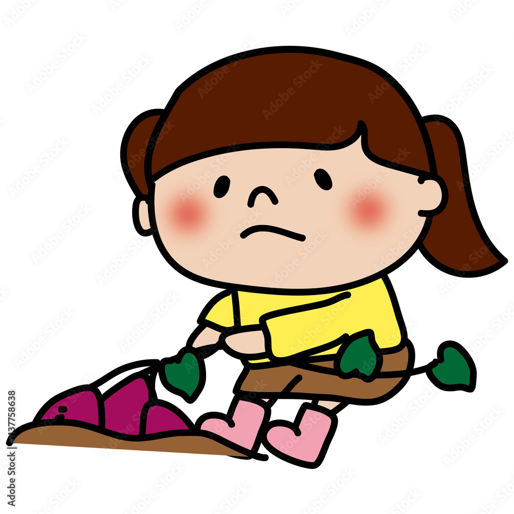 お芋掘りでツルを引っ張る子供（女の子）