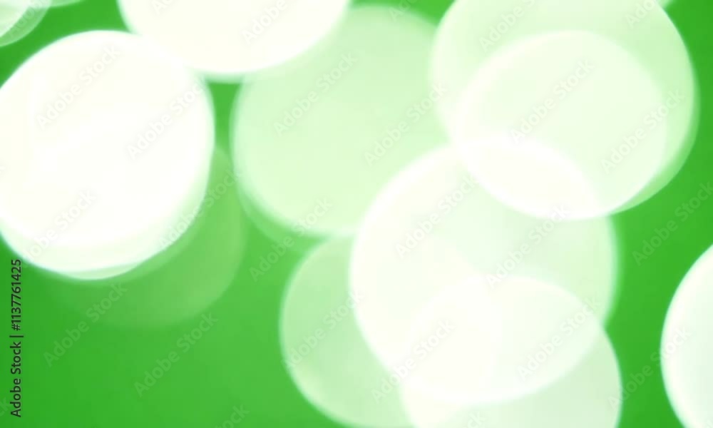Visual motion graphics on colorful light glitter flying, particles light flowing background flickering particles with bokeh shine effect on green screen
