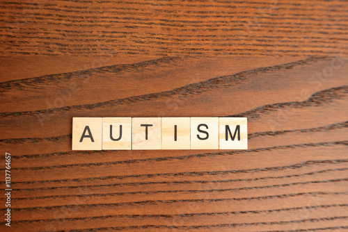 Wooden blocks with the word Autism. Neurological and developmental disorder. ASD photo