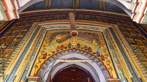 Entrance of Krishna Chandraji's Temple adorned with beautiful paintings depicting floral and divine motifs, Guptipara, Hooghly, West Bengal, India. photo