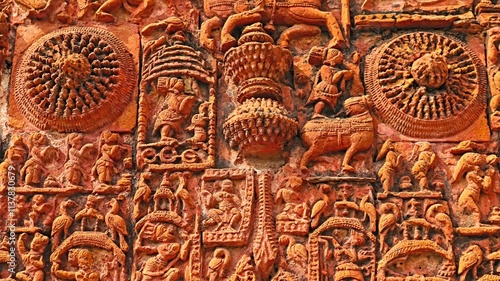 Sculptures illustrating birds, animals, and daily human life on Sri Raghunath Temple, Ghurisha , Birbhum, West Bengal, India. photo