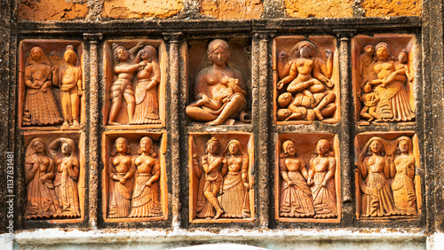 Artistic depictions of daily human life in terracotta on Lakshmi Janardan Temple, Ghurisha , Birbhum, West Bengal, India. photo