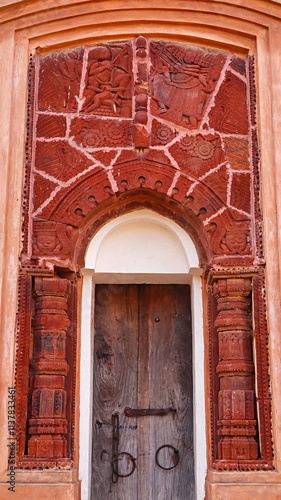 A small, intricately carved temple from the 15th century located in the Chhai Taraf Temple Complex, Maluti, Dumka, Jharkhand, India. photo