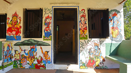 Scenes from Krishnaleela (Lord Krishna's life) beautifully painted on the Odia tribal hut in Srijani Shilpagram, Sriniketan, Bolpur, West Bengal, India. photo