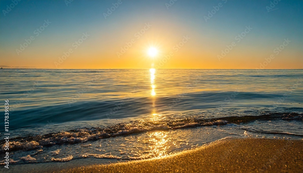 Obraz premium Golden Heart-Shaped Sunlight Reflected on Calm Ocean Waves During a Magical Sunrise