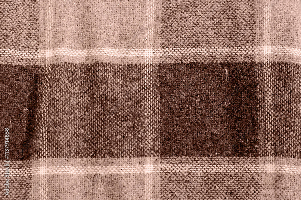 Fototapeta premium Close-up of plaid fabric in mocha-mousse tones