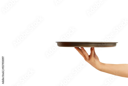 Man hand holding a metal tray on a yellow background with copy space
