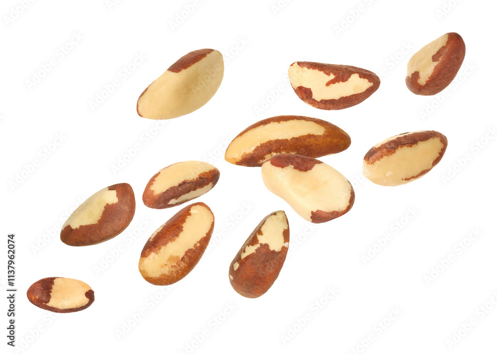 Many Brazil nuts in air on white background Many Brazil nuts in air on white background