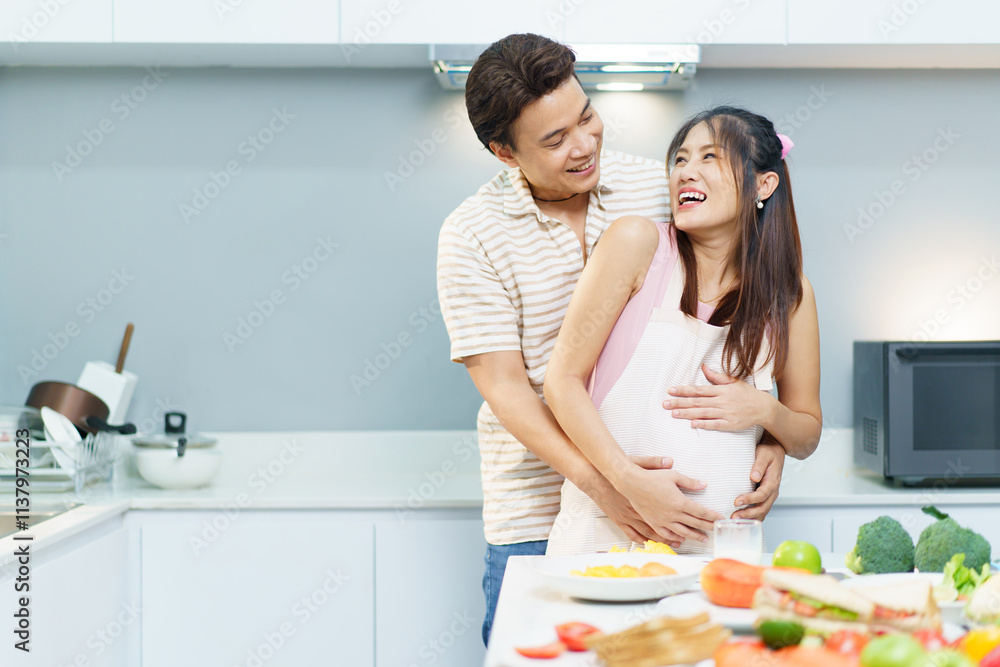 Husband and pregnant wife making a food together. Husband and pregnant wife making a food together.