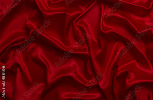 The top view of the red satin surface looks luxurious and beautiful. with sparkling waves Abstract background design copy space Card or banner (blurred or blurry)