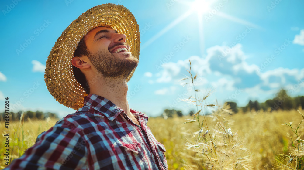 Obraz premium Young man in straw hat enjoying a sunny day in the field