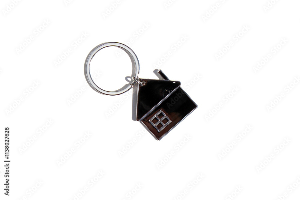 A keychain with a key lies on a white isolated background. A keychain with a key lies on a white isolated background.