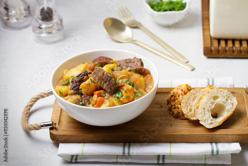 Slow cooked beef stew with potatoes, carrots and onions