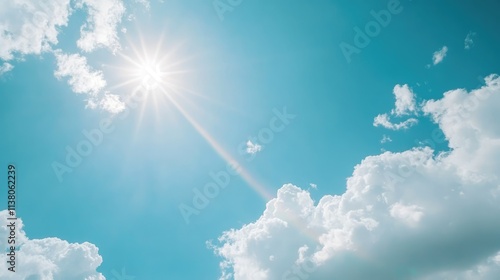 Vibrant double rainbow against a bright blue sky with fluffy clouds and sunburst creating a serene and uplifting cloudscape background. photo