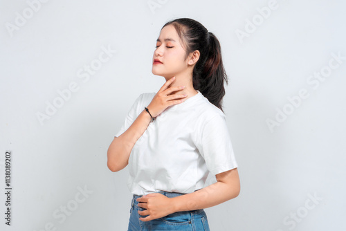 Photos Asian woman holding his throat with his hands, feeling pain isolated on white ba