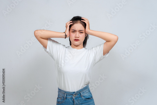 Portrait of young Asian woman isolated on white background feeling frustrated with helpless face expression.