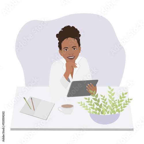 Smiling dark-skinned doctor woman sitting at table with tablet
