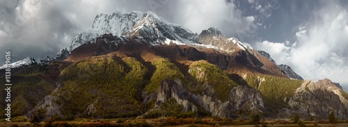 Panoramic view of snow mountains and forests of Annapurna Massif in Himalayas...