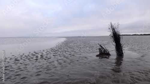 Wegmarkierungen durchs Wattenmeer bei Ebbe, Nordsee, Gezeiten, Wattwanderweg photo