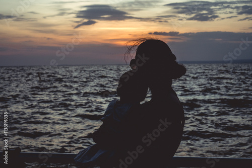Mother and child in the sunset