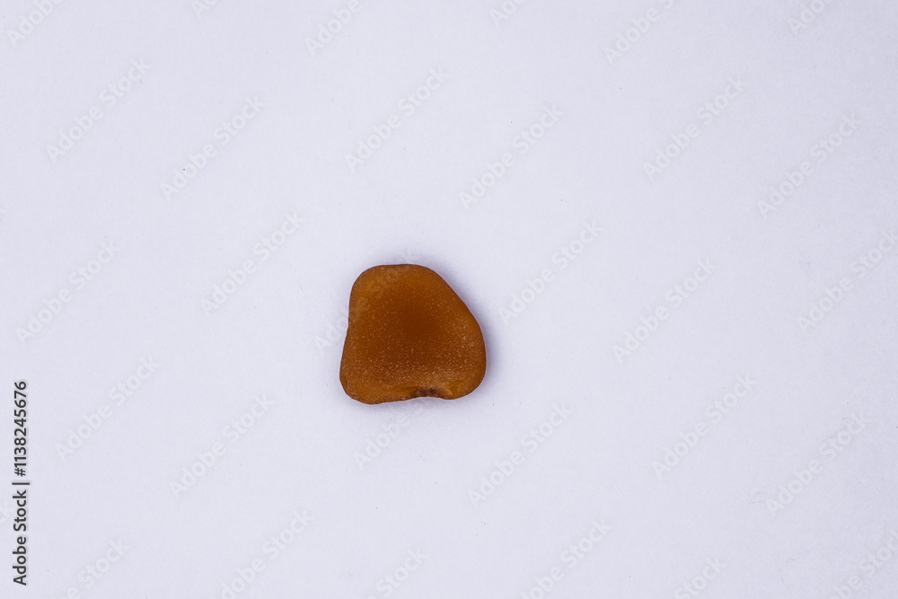 Obraz premium Stones isolated on a white background, Collection of various sea pebble stones on white background. Top view, flat lay, pebble beach isolated on white, Smooth sea rocks, colorful pebbles isolated.