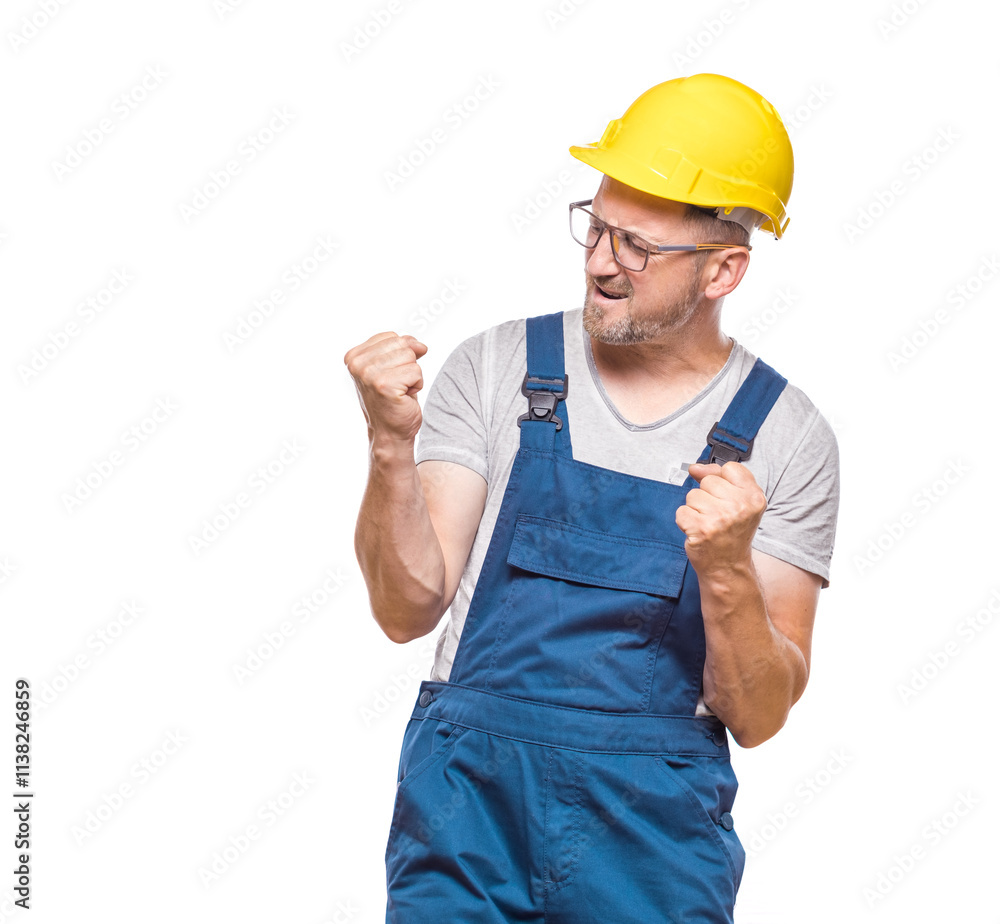 Excited middle-aged construction worker with clenched fists, isolated on white background. Yes concept. Good news. Copy space. Rejoicing repairman celebrates success. Craftsman against white wall Excited middle-aged construction worker with clenched fists, isolated on white background. Yes concept. Good news. Copy space. Rejoicing repairman celebrates success. Craftsman against white wall