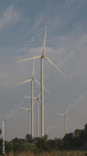 Video Vertical, Wind Turbines Generating Renewable Energy Against a Clear Sky
